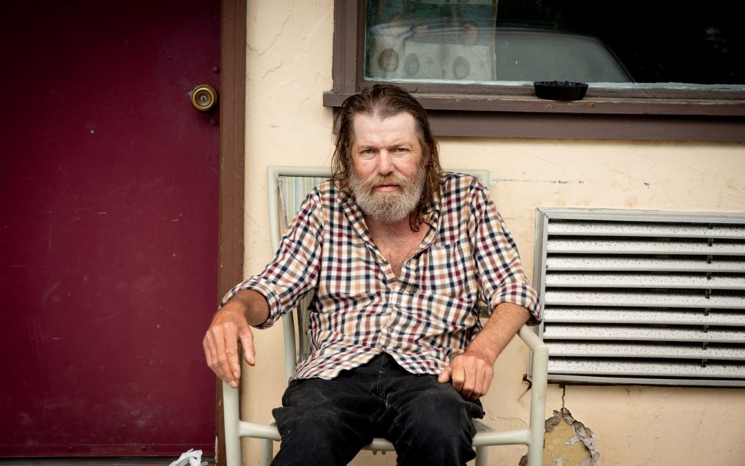 man in front of motel